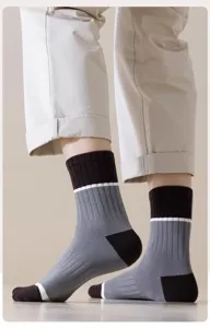 Detailed view of men's striped mid-calf socks with comfortable ribbed cuff design.