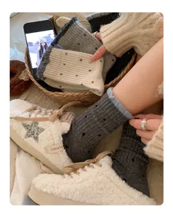 Cozy autumn winter polka dot socks and fluffy star sneakers detail lifestyle shot view.