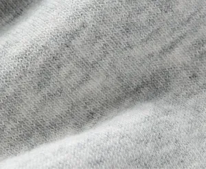 Close-up detail shot of the soft breathable men's knit sock fabric with grey and white texture.
