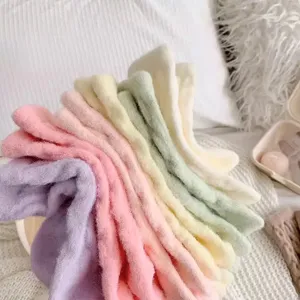 Detailed view of cozy fuzzy winter women socks, soft plush warm sleep socks in pastel candy colors.