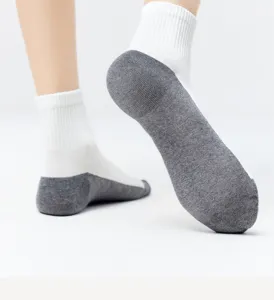 Detail shot of breathable men's mid-tube socks with grey heel sole, comfortable.