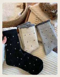 Cozy winter polka dot knitted socks detail, retro style warm soft thermal crew socks for women.