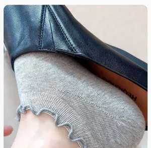 Close-up detail of women thin breathable low-cut socks with cute ruffle lace trim.