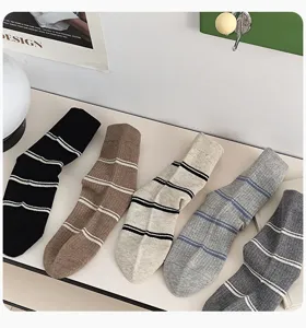 Casual striped mid-tube socks for women, comfortable knit fabric, perfect autumn winter daily wear.