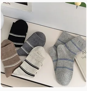 Detailed view of women's autumn winter casual striped mid calf socks in versatile classic colors.