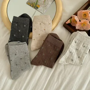 Cute floral mid-tube socks for women, soft casual knit hosiery with vintage aesthetic style.