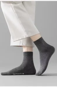 Men grey mid tube socks close up detail showcasing soft knit fabric and comfortable fit.