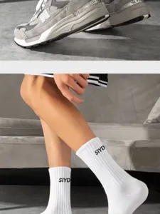 Men's white cotton crew socks with stylish letter print, comfortable athletic tube socks.