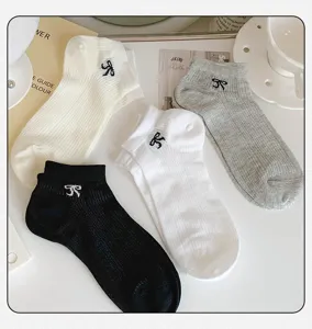 Detail shot of women summer thin mesh breathable short socks with cute bow embroidery.