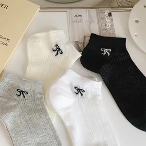Korean style hollow breathable short socks with cute bow embroidery, thin mesh design for women.