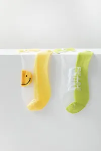 Close-up detail of summer sheer ice silk mesh short socks featuring cute daisy and smiley accents.