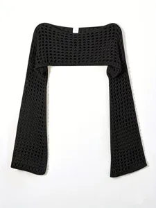 Black knit hollow-out shrug detail, showing delicate mesh texture and long flared sleeves.