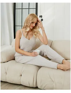 Cozy fuzzy fleece pajama set for women, soft thermal camisole and pants loungewear detail.