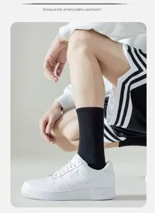 Premium antibacterial cotton mid-tube socks for men and women, solid color casual sports long socks.