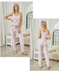 Detail view of fluffy pink camisole pajama set, soft knit texture, cozy home wear style.