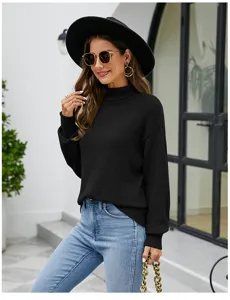 Detailed shot of a classic black turtleneck sweater worn by a model, showcasing texture and fit.