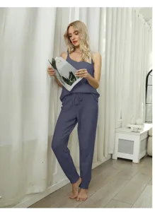 Cozy solid color fleece pajama set detail view, featuring soft camisole and comfy pants.