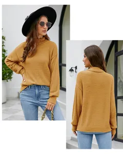 Detail view of mustard yellow turtleneck knit sweater, showing front and back look.