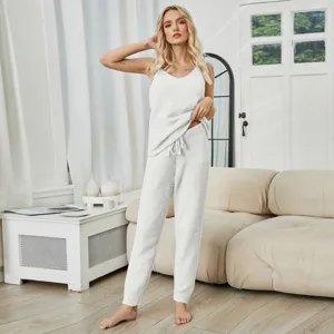 Cozy women fuzzy fleece loungewear set, soft camisole and pants for warm autumn and winter.