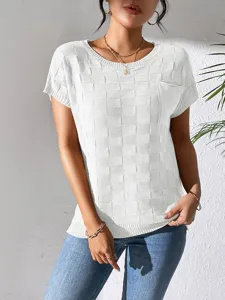 Close-up of white knit short-sleeve top with grid texture, round neck and chest pocket.