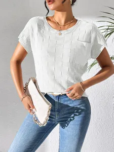 Detailed view of casual short sleeve knit top, solid white textured fabric, elegant style.