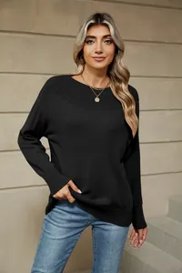 Close-up detail of the solid black boat-neck long-sleeve knit sweater for women.