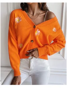 Orange knit cardigan featuring sweet daisy embroidery and a classic V-neckline for daily wear.