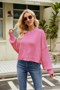 Casual pink knit sweater detail, loose short crewneck long sleeve top street fashion look.