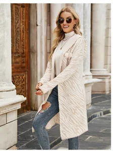 Long hooded knitted cardigan featuring a stylish zebra pattern, perfect for cozy autumn wear.