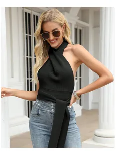 Close-up detail of the black halter neck knitted crop top featuring a stylish wrap design.