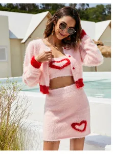 Pink fuzzy knit 3-piece set featuring a long sleeve cardigan, camisole, and skirt with hearts.