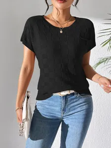 Black knit short sleeve top with textured grid pattern and pocket for women commuting style.