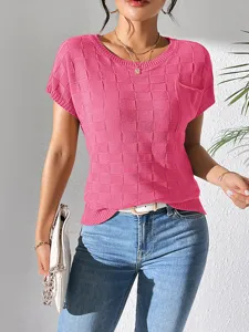 Detail view of pink textured knit short sleeve top for women, casual summer style.