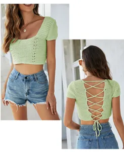 Green knit crop top detail view showing front square neck and back lace-up cross straps.