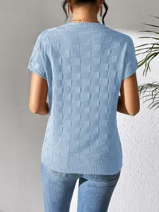 Detailed view of the light blue short-sleeve knitted top, featuring a stylish grid texture.