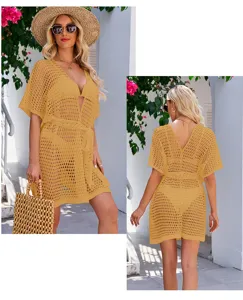 Detail view of women's yellow hollow knitted beach cover-up showing front and back.
