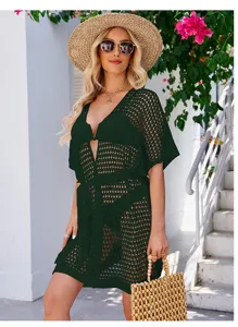 Detailed view of the dark green hollow knit cover-up, showcasing exquisite crochet texture.