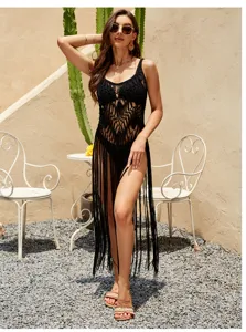 Black crochet fringe beach cover-up detail, stylish halter hollow-out design for summer holiday.