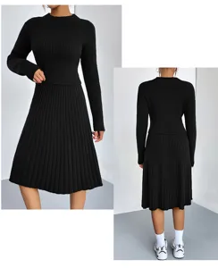 Detail view of black knit sweater and A-line midi skirt set, showcasing ribbed knit texture.