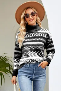 Detailed view of women's black and white patterned turtleneck knit sweater in casual style.