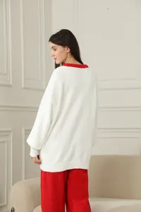 Cosy fuzzy long sleeve loungewear set with white top and red pants for relaxing at home.