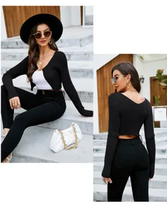 Close-up detail of women's black ribbed cropped cardigan, sexy slim fit outdoor style.