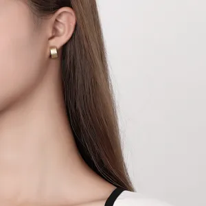 Minimalist wide brushed gold hoop earrings for women, chic French style sterling silver studs.