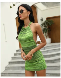 Detail view of green halter knit mini dress, bodycon sleeveless backless design for summer.