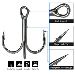 Detailed view of high-carbon steel treble fishing hook with sharp barb and strong hook eye.