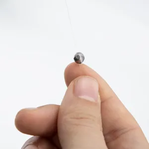 Fishing sinker weight detail shot, small fishing tackle accessory for outdoor line rigs.