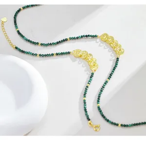Detail view of S925 sterling silver malachite five emperors coins necklace bracelet chic jewelry.