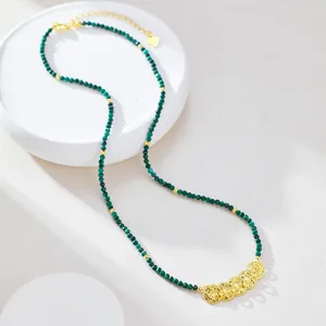 Green beaded clavicle chain with vintage gold coin pendants, elegant New Chinese style jewelry.