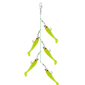 Detail view of fluorescent yellow soft plastic fishing lures cluster rig for sea fishing.