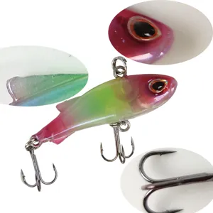 Detailed view of fishing lure showing realistic 3D eyes, sharp treble hooks and fin design.